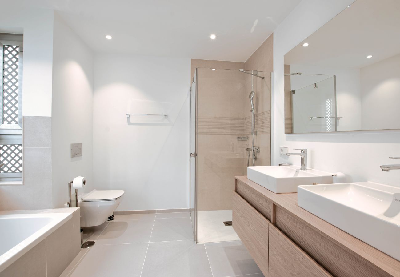 Main bathroom with bathtub and shower 